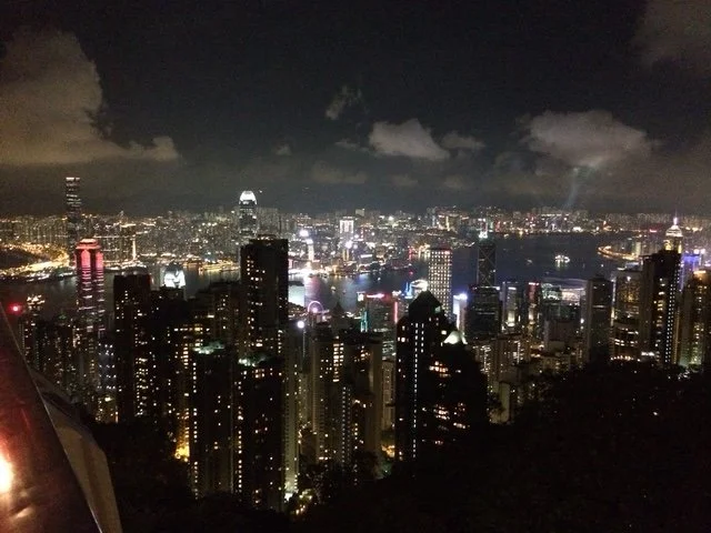 Nighttime cityscape of Hong Kong nightly light show from Victoria Peak