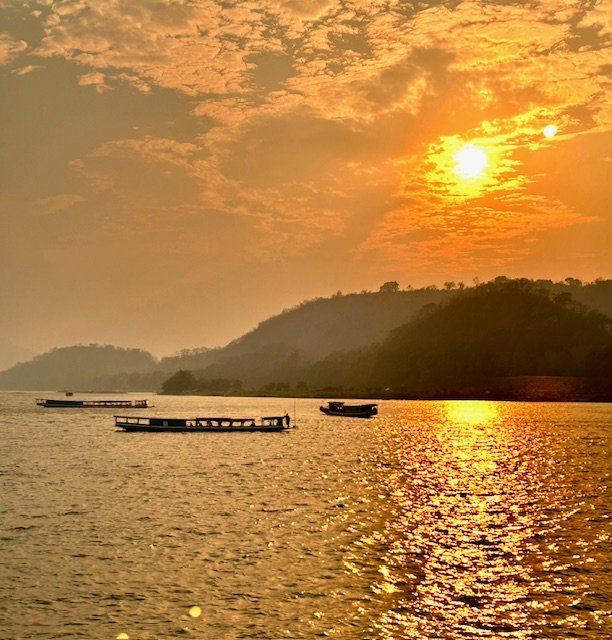 Sunset cruise on the Mekong River with local boats