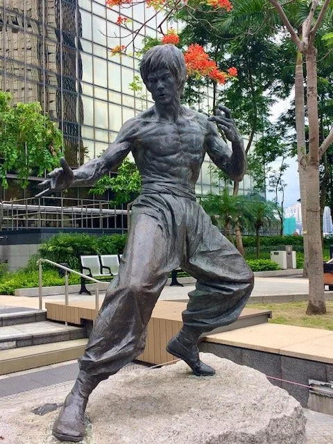 A bronze statue of Bruce Lee on the Avenue of Stars