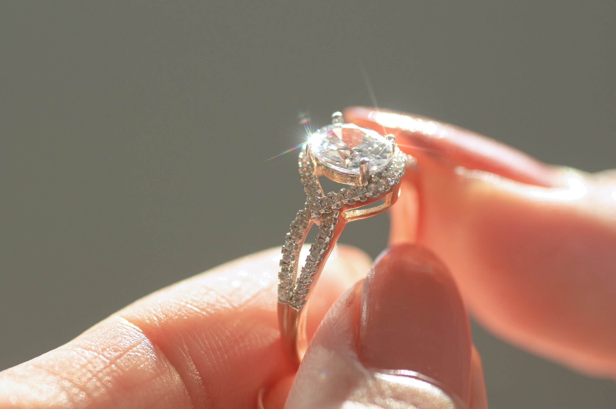 close-up-view-of-a-diamond-ring-and-woman-hand-2025-03-12-22-24-22-utc.jpg