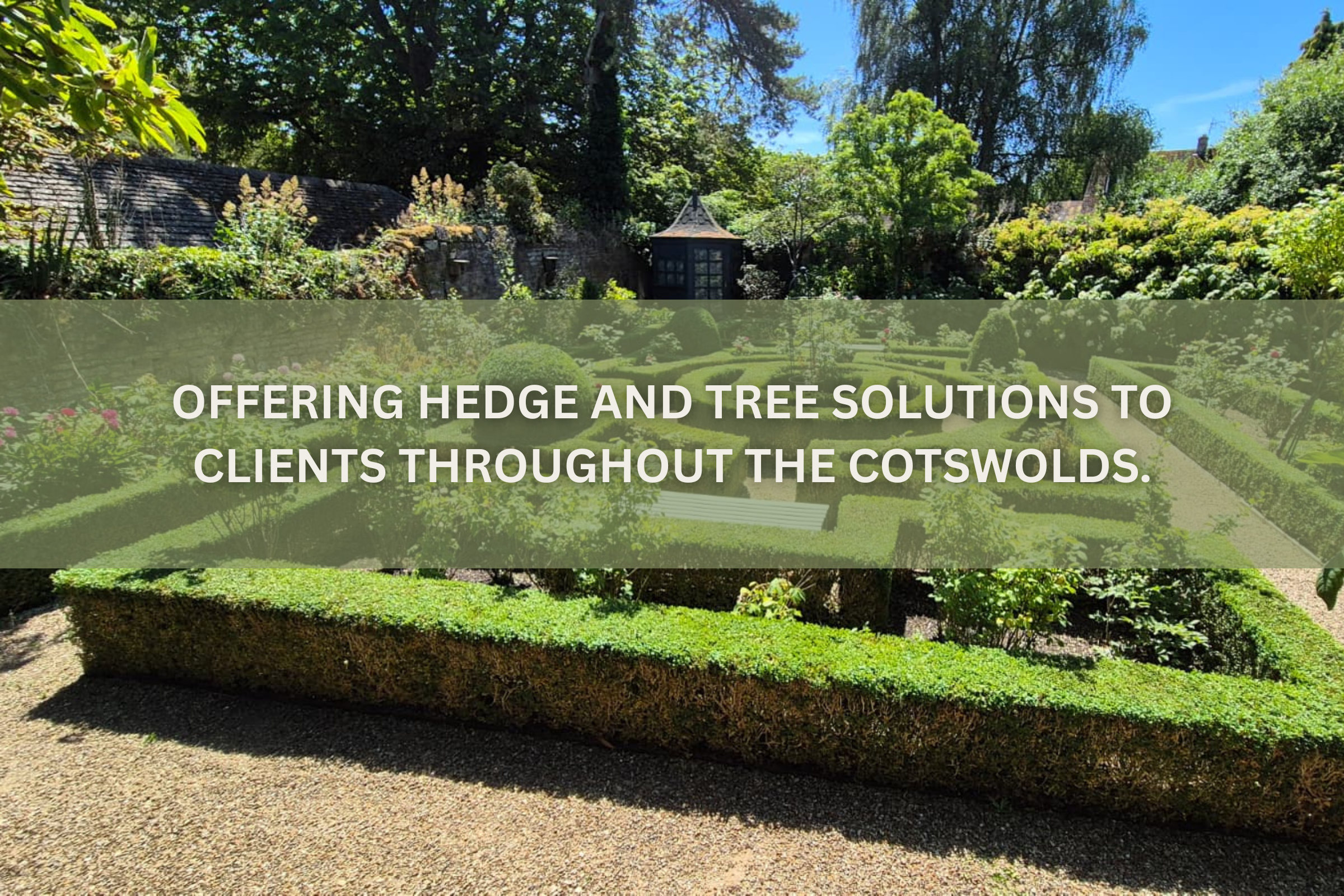 A well-maintained formal garden with trimmed hedges, lush trees, and a small gazebo in a scenic outdoor setting in the Cotswolds.