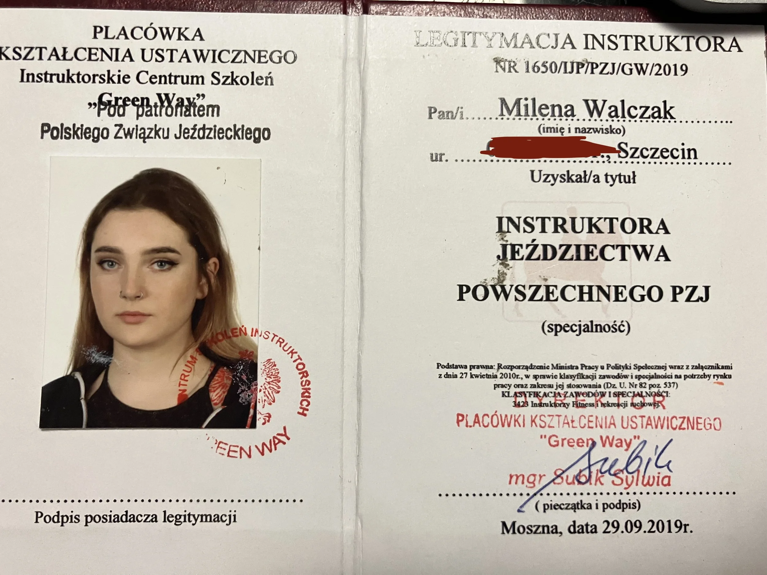 A Polish instructor license featuring a photograph of a young woman with long brown hair, blue eyes, and a nose piercing. The document contains various stamps, signatures, and official text in Polish, including the woman's name, Milena Walczak, and details of her instructor qualification in riding.
