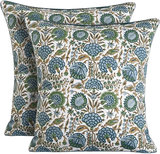Two decorative pillows with a floral and leaf pattern in shades of blue, green, and beige.