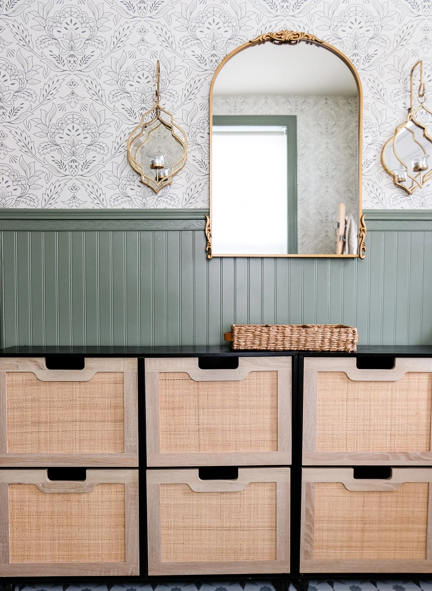 An entryway is the first impression of a home. Here, Moroccan-inspired wallpaper brings texture, movement, and a sense of heritage to the space.