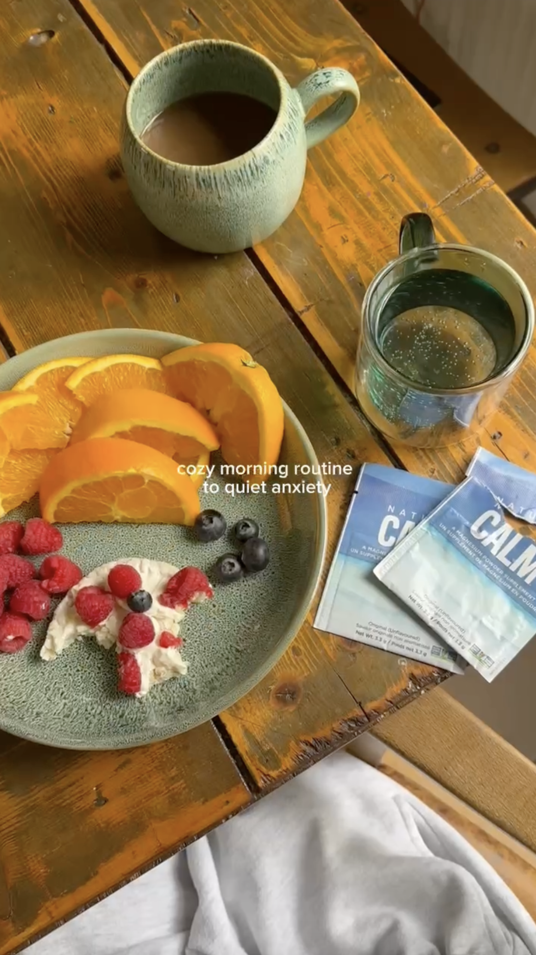 Breakfast fruit plate with packets of Natural Calm beside the plate.