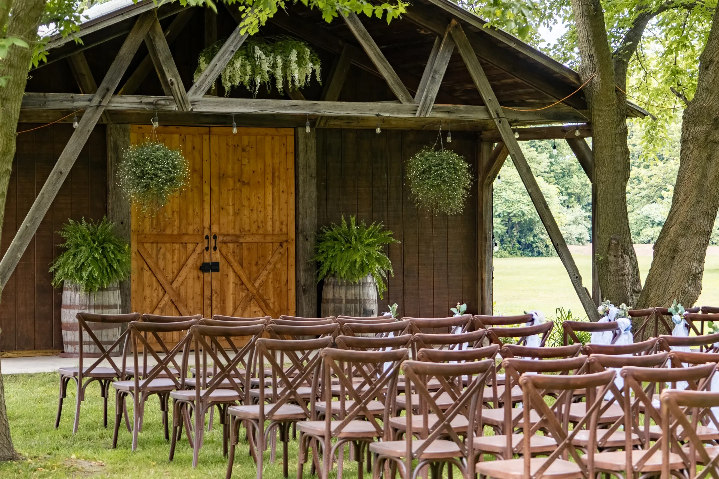 Rustic Barn Backdrop with Cross-Back Chairs