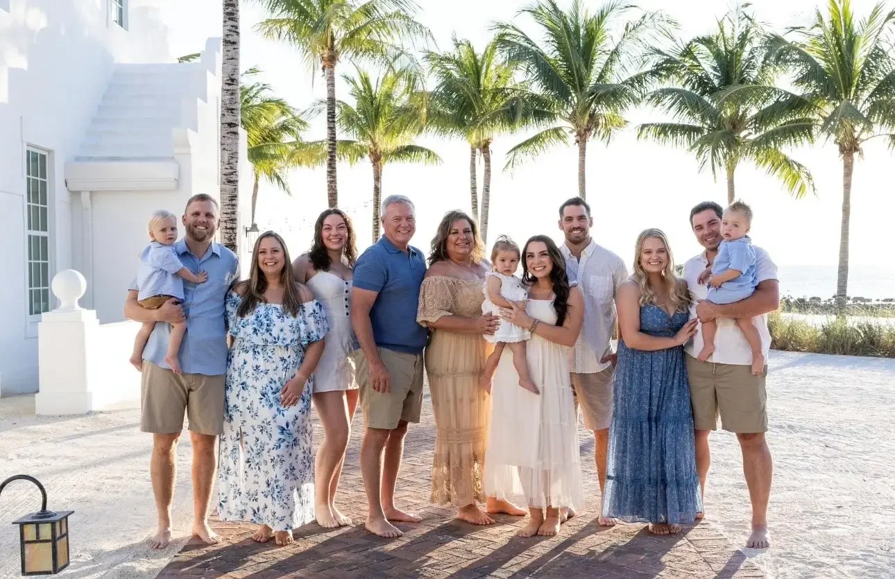 The Daniels family, including children and grandchildren, on vacation from their family-owned wedding venue.
