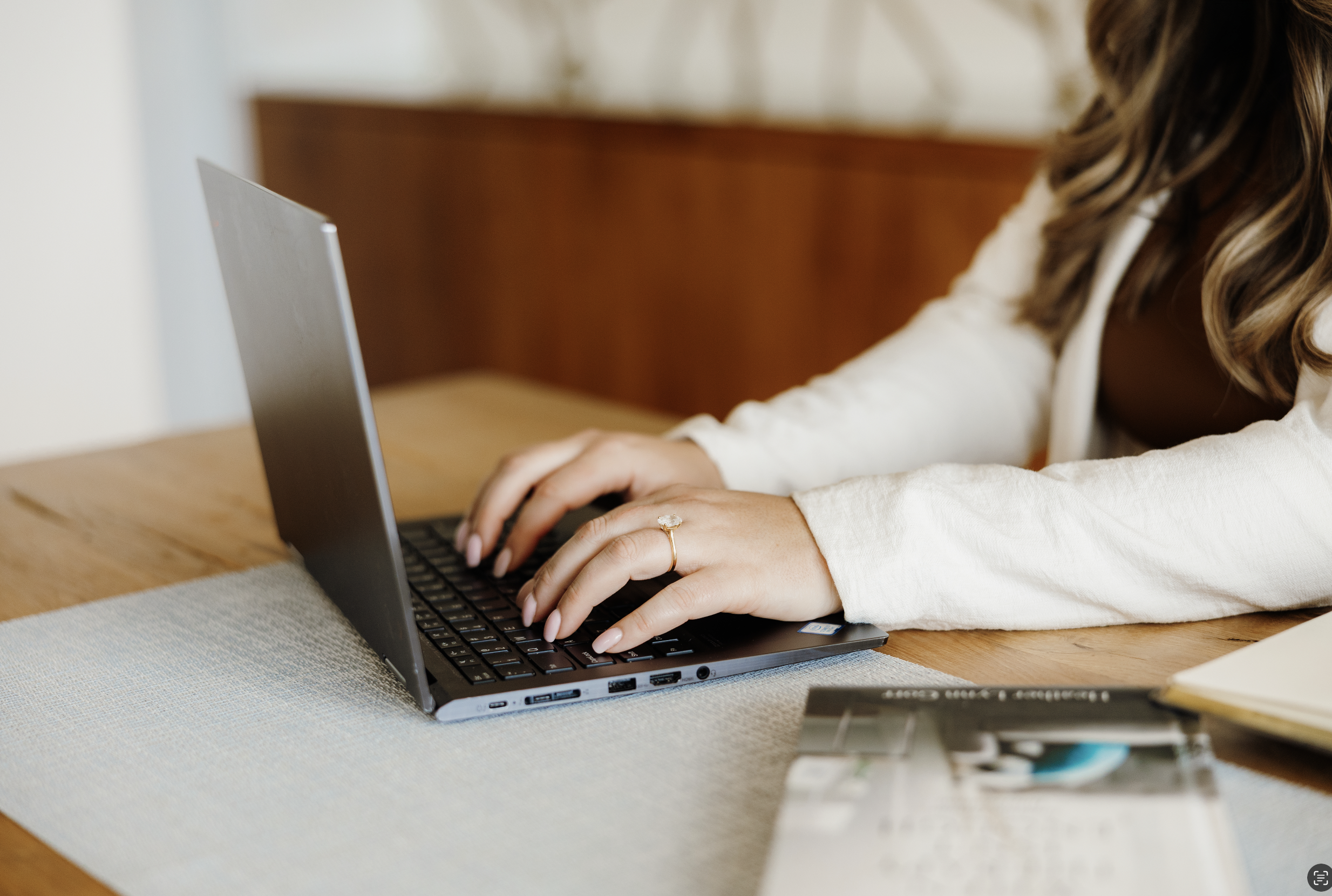 Heather Gorr, LPC-S, trauma-informed therapist and clinical supervisor based in Austin, Texas | Woman's hands typing on a laptop