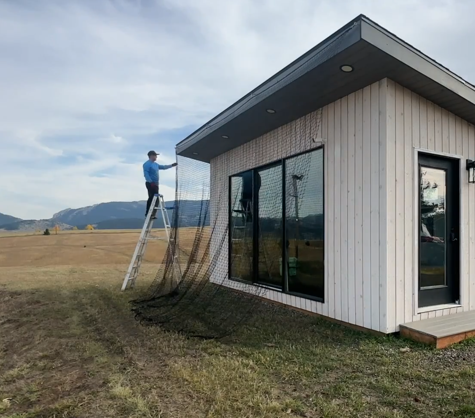 Installing netting on warming house to protect window