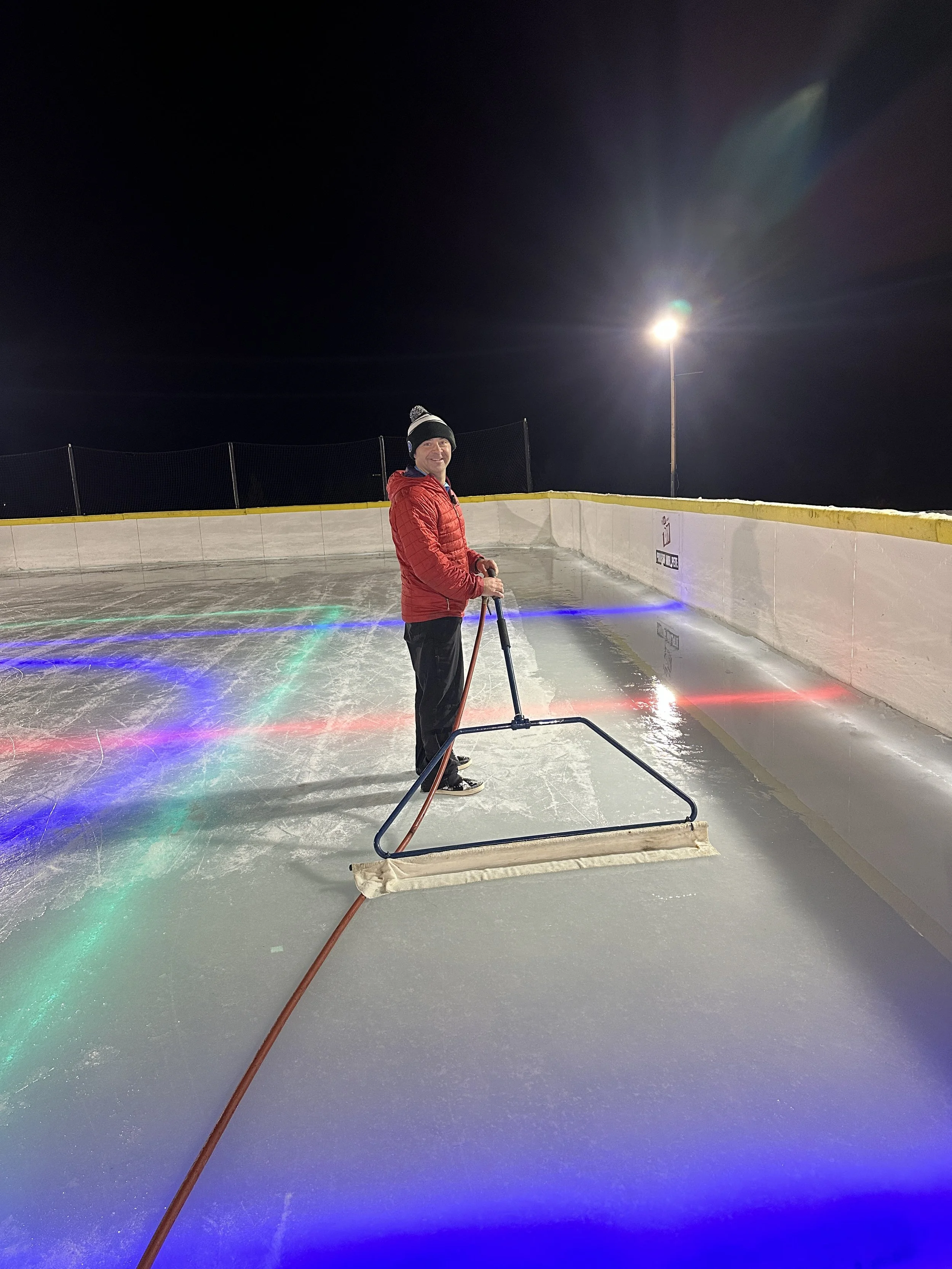 on the outdoor ice using a pull behind ice resurfacer