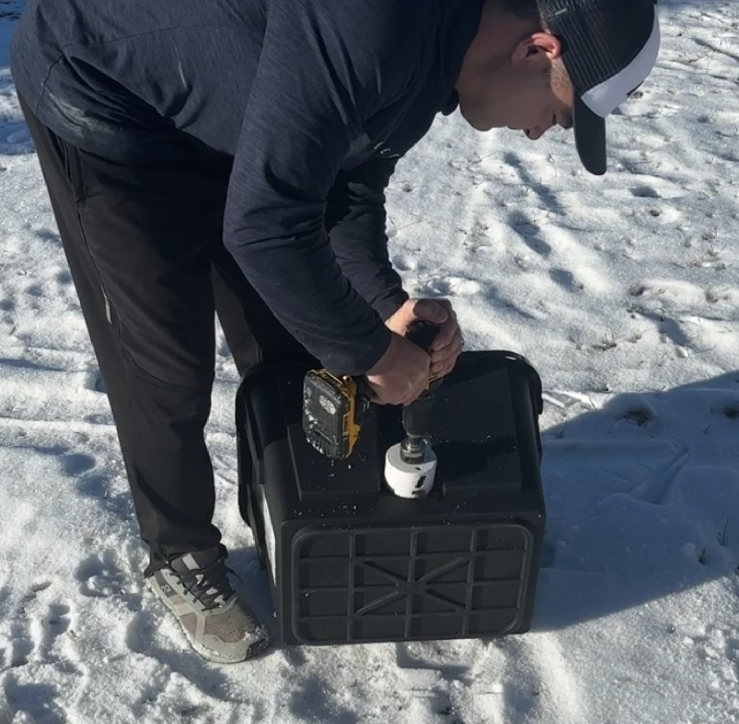 Cutting a hole in a tote to store cords in