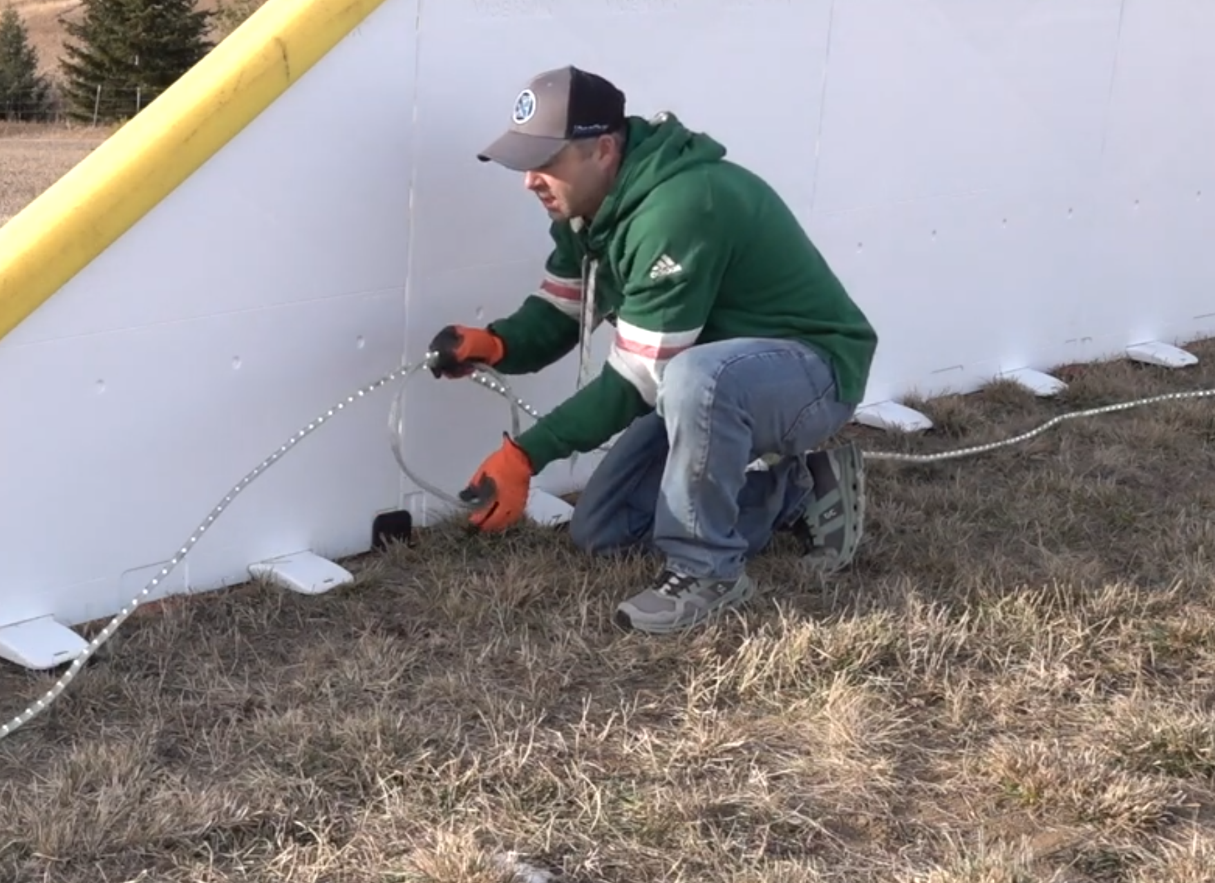 Laying down the white LED lights around the perimeter of rink