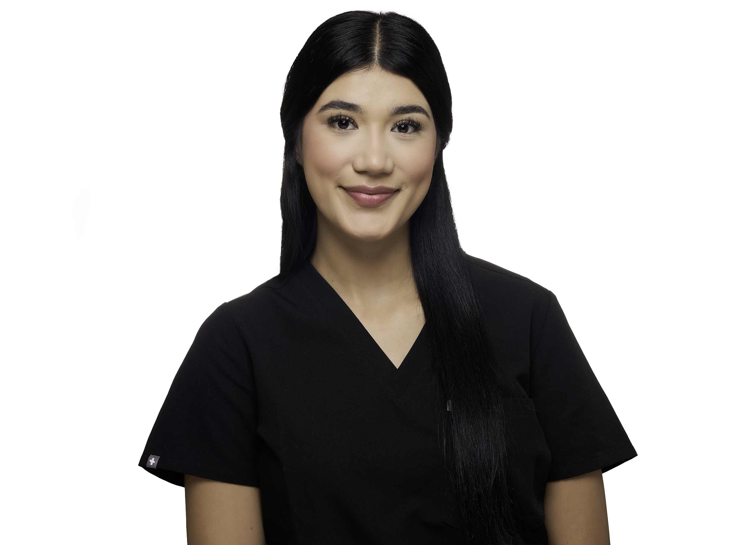 Portrait of a smiling woman with long black hair wearing a black top, against a white background.