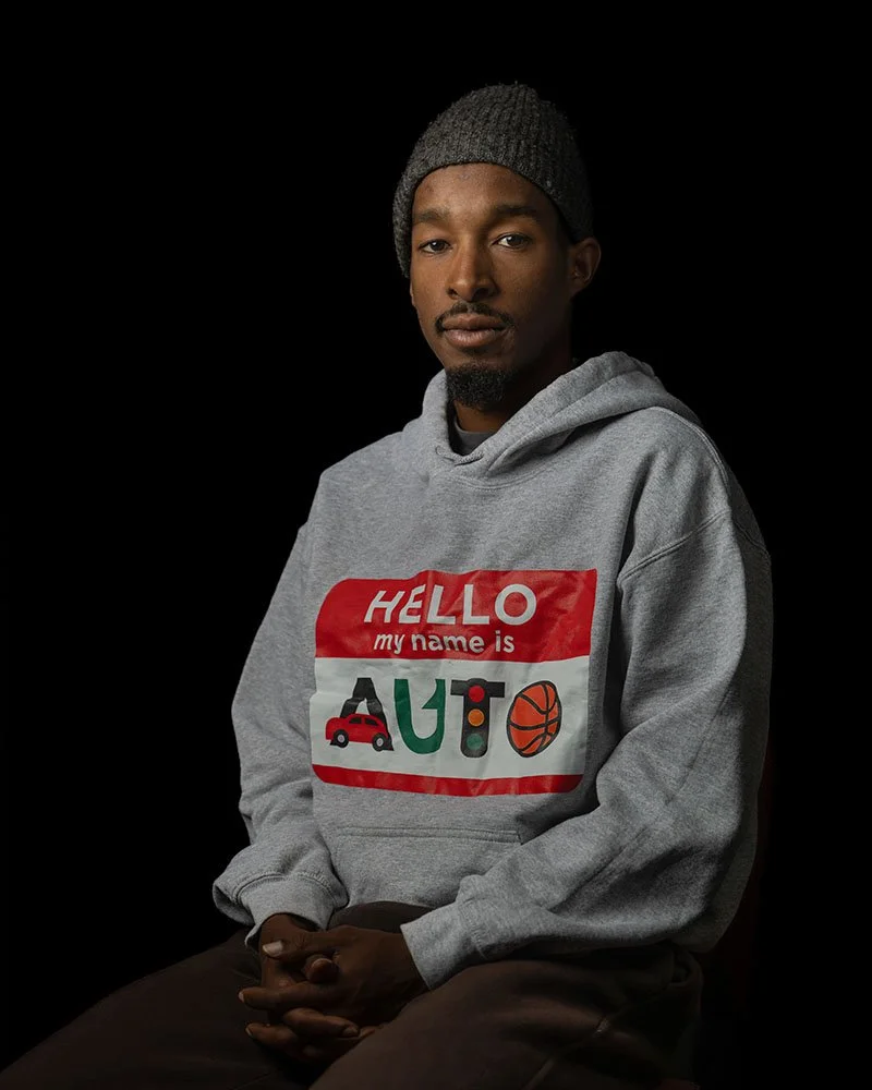 A portrait of Aden Haji