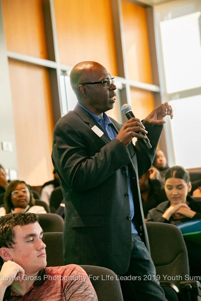 Contributing to the discussion in the auditorium.jpeg