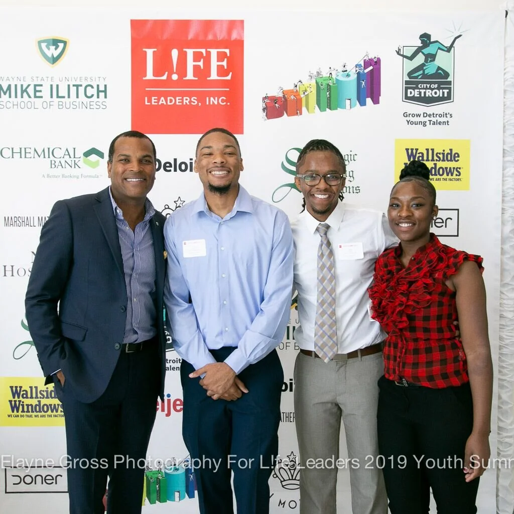 Donnell White, Curtis, Mario and Charvae with step and repeat.jpeg