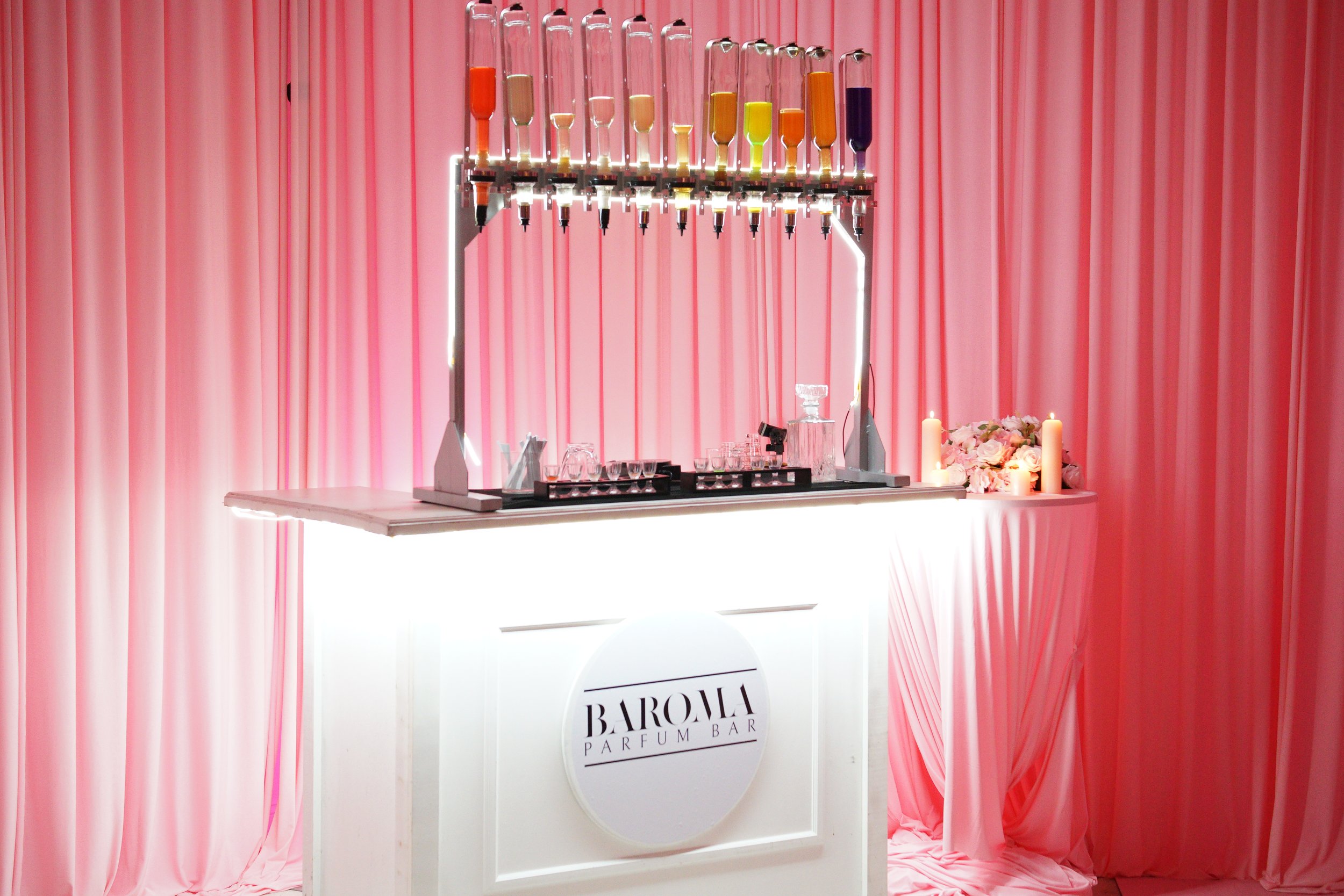 Luxury mobile parfum bar setup in Atlanta featuring curated fragrance oils, custom bottles, and a guided fragrance experience at a private event.