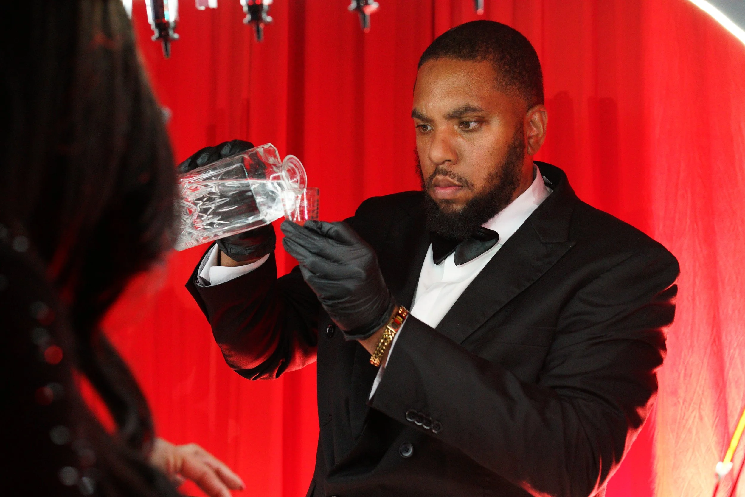 Baroma Parfum Bar founder carefully pouring a custom fragrance during a luxury mobile perfume bar experience, showcasing the professional, hands-on process at an upscale Atlanta event.