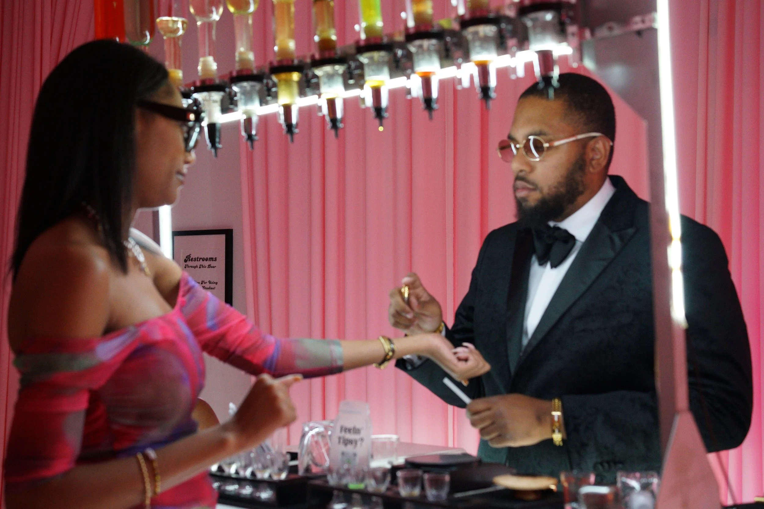 Baroma Parfum Bar founder applying a custom fragrance to a guest’s arm during a luxury mobile perfume bar experience, demonstrating the professional, guided perfume service at an upscale Atlanta event.
