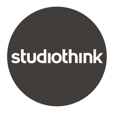 Studiothink logo with white text inside a black circle.