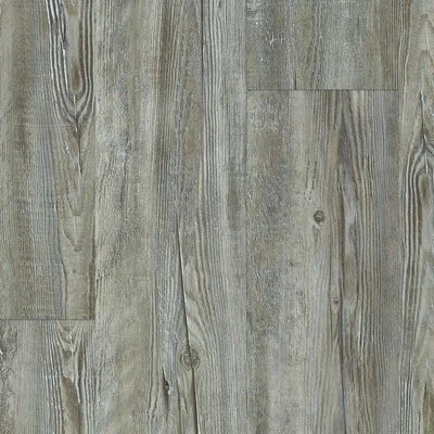 Close-up of wooden floor with grayish-brown planks and visible grain patterns.