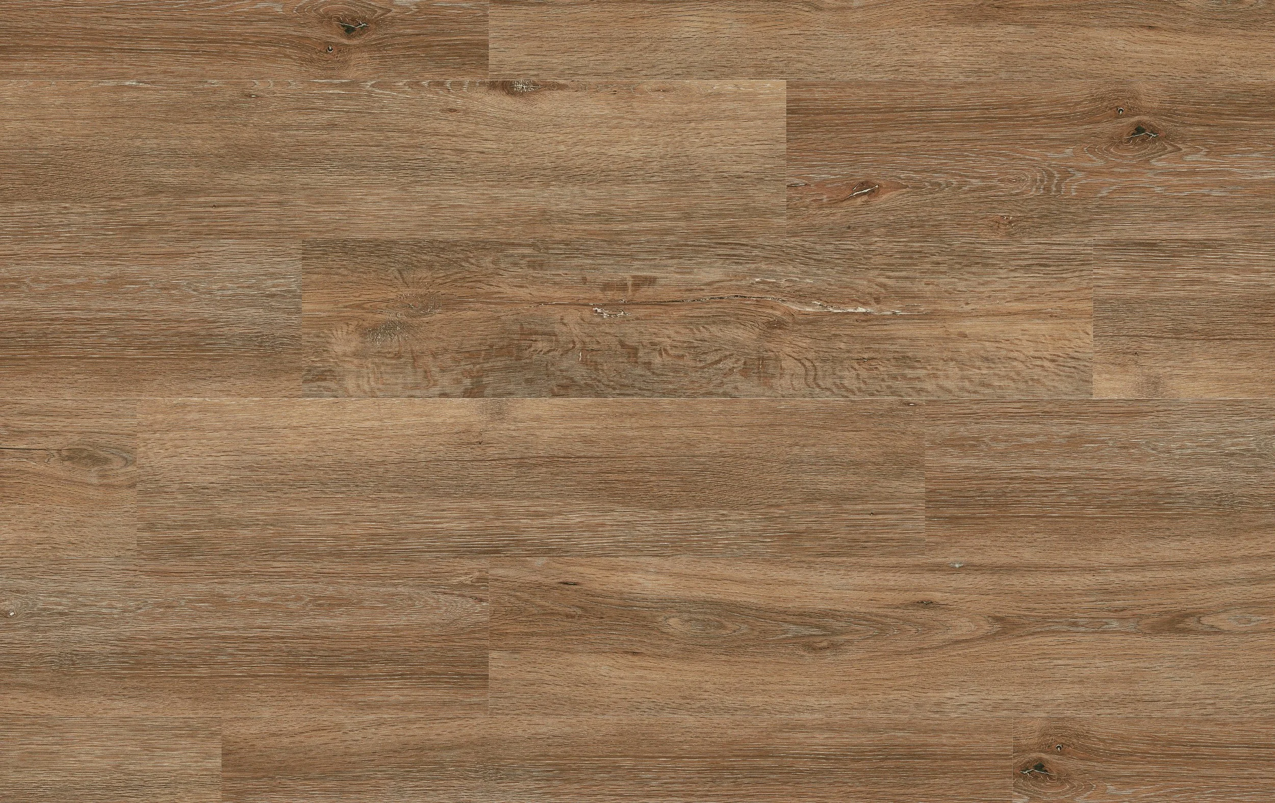Close-up of a wooden floor with visible wood grain and knots, showing a natural light brown color.