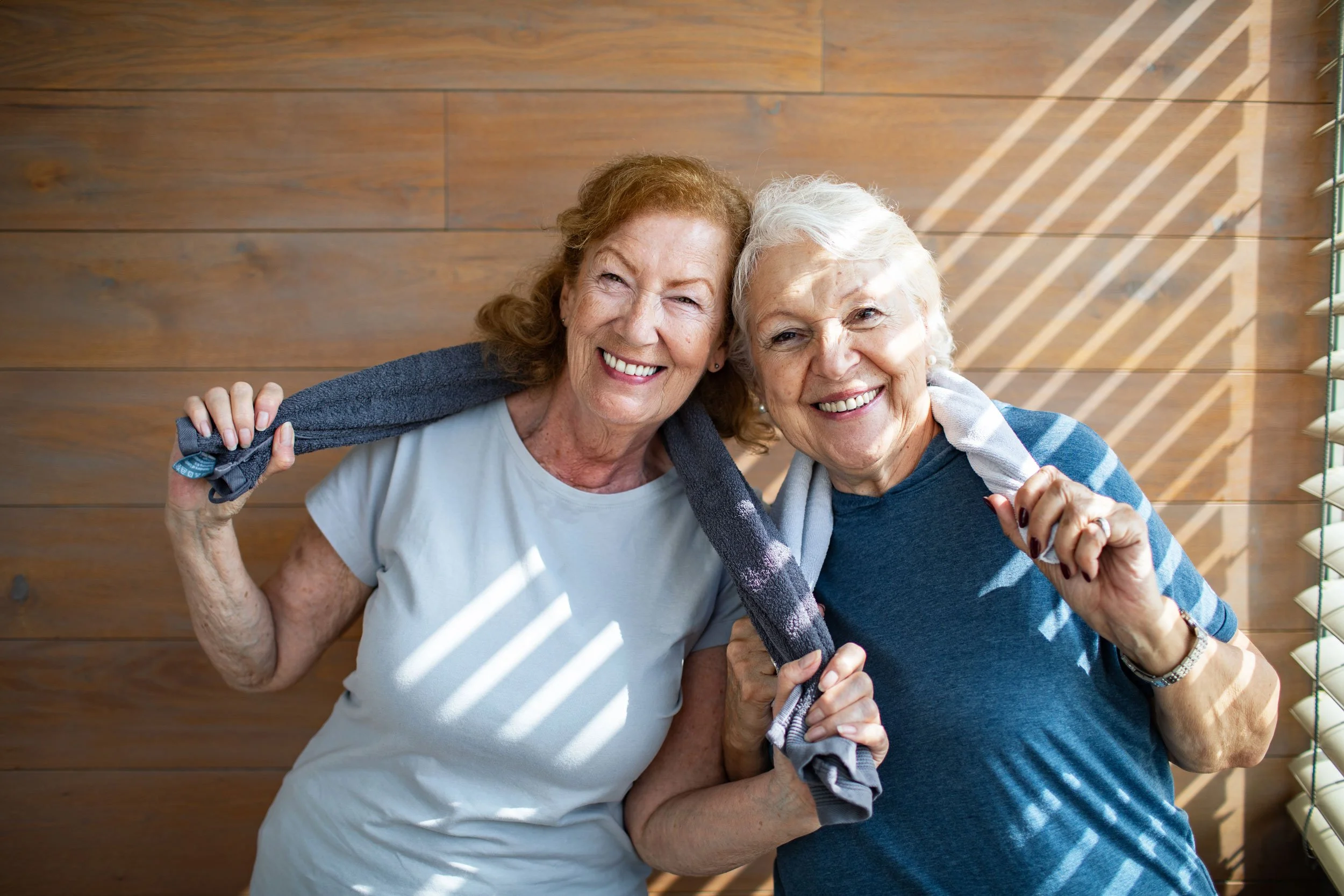 Two older women at a wellness retreat symbolizing friendship, well-being, and community support