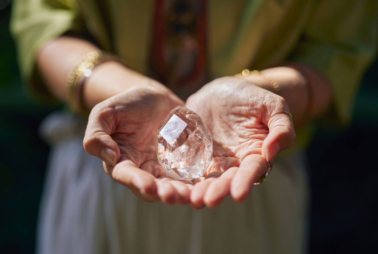 Hands holding a crystal, reflecting mindful living and CELE’s focus on intentional personal development.