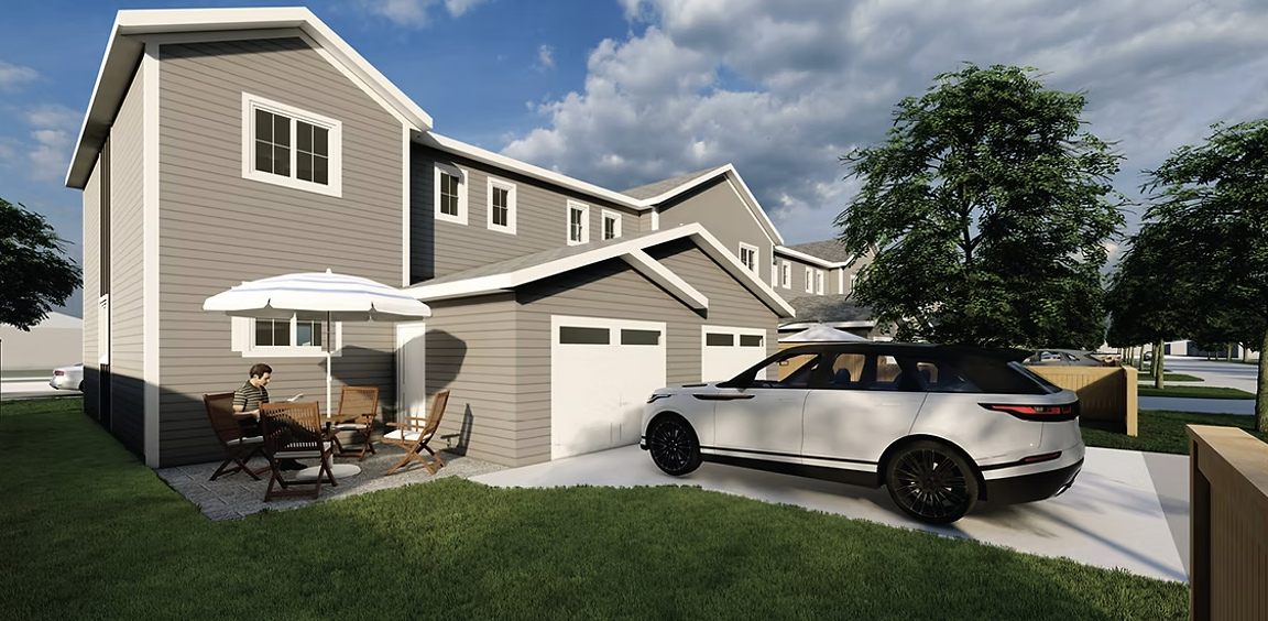 A K Block Developments modern two-story house with gray siding, a driveway with a white SUV, a patio with a person sitting under a white umbrella, trees, and a partly cloudy sky.