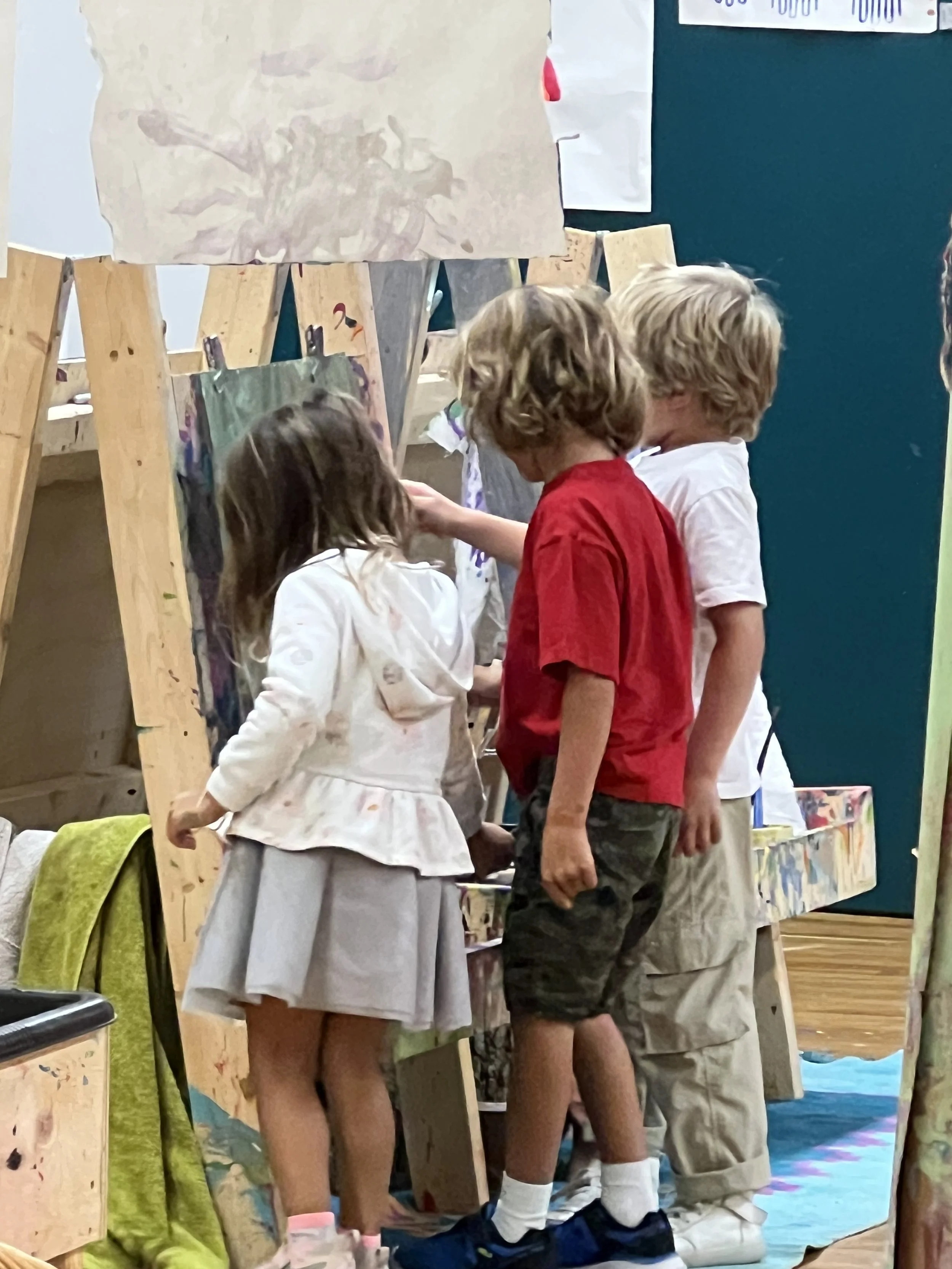 3 school aged kids at easel together Rosedale photo.jpg