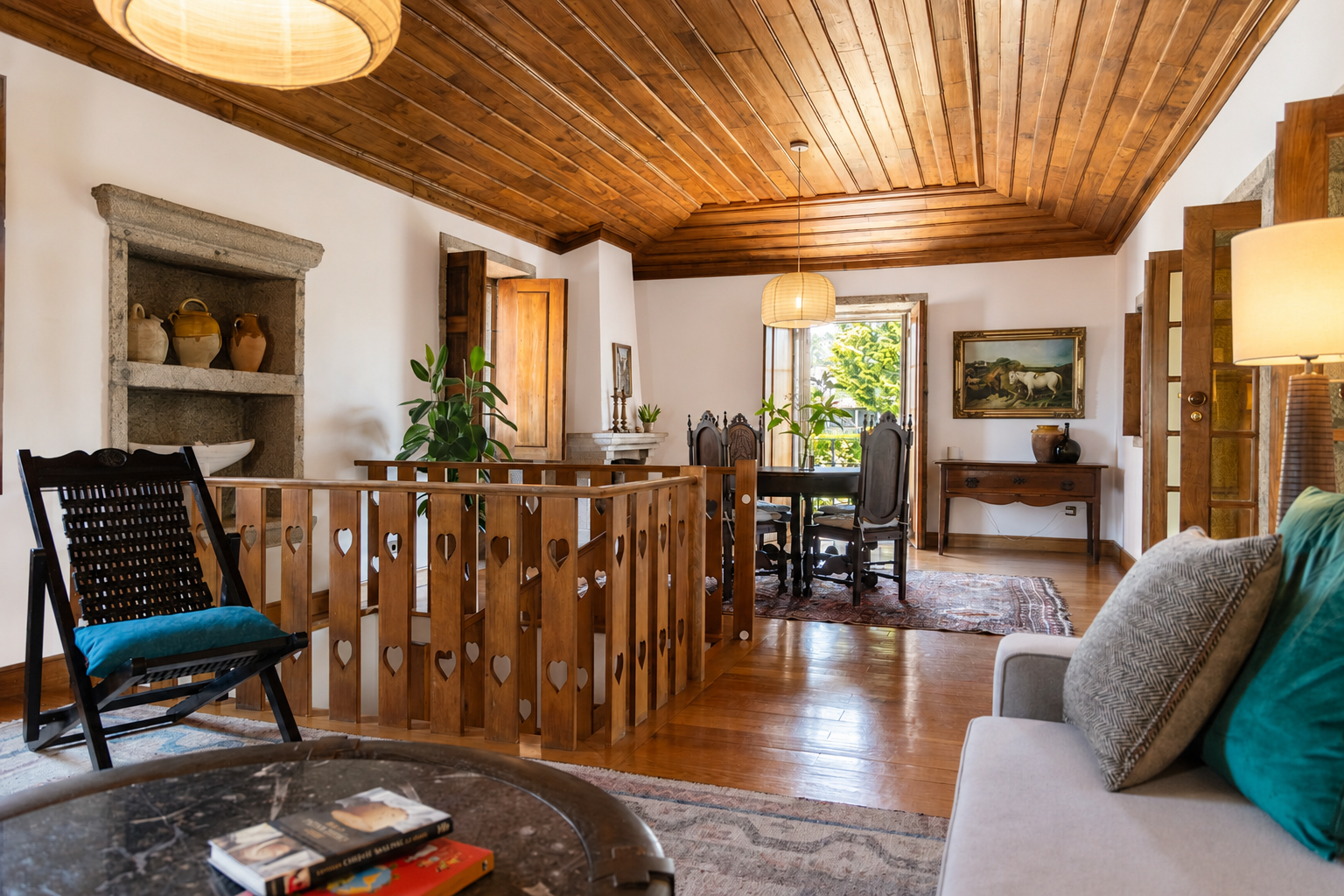Warm, inviting and cozy living room featuring authentic, rustic wooden ceiling represents the most historic part of the Quinta.