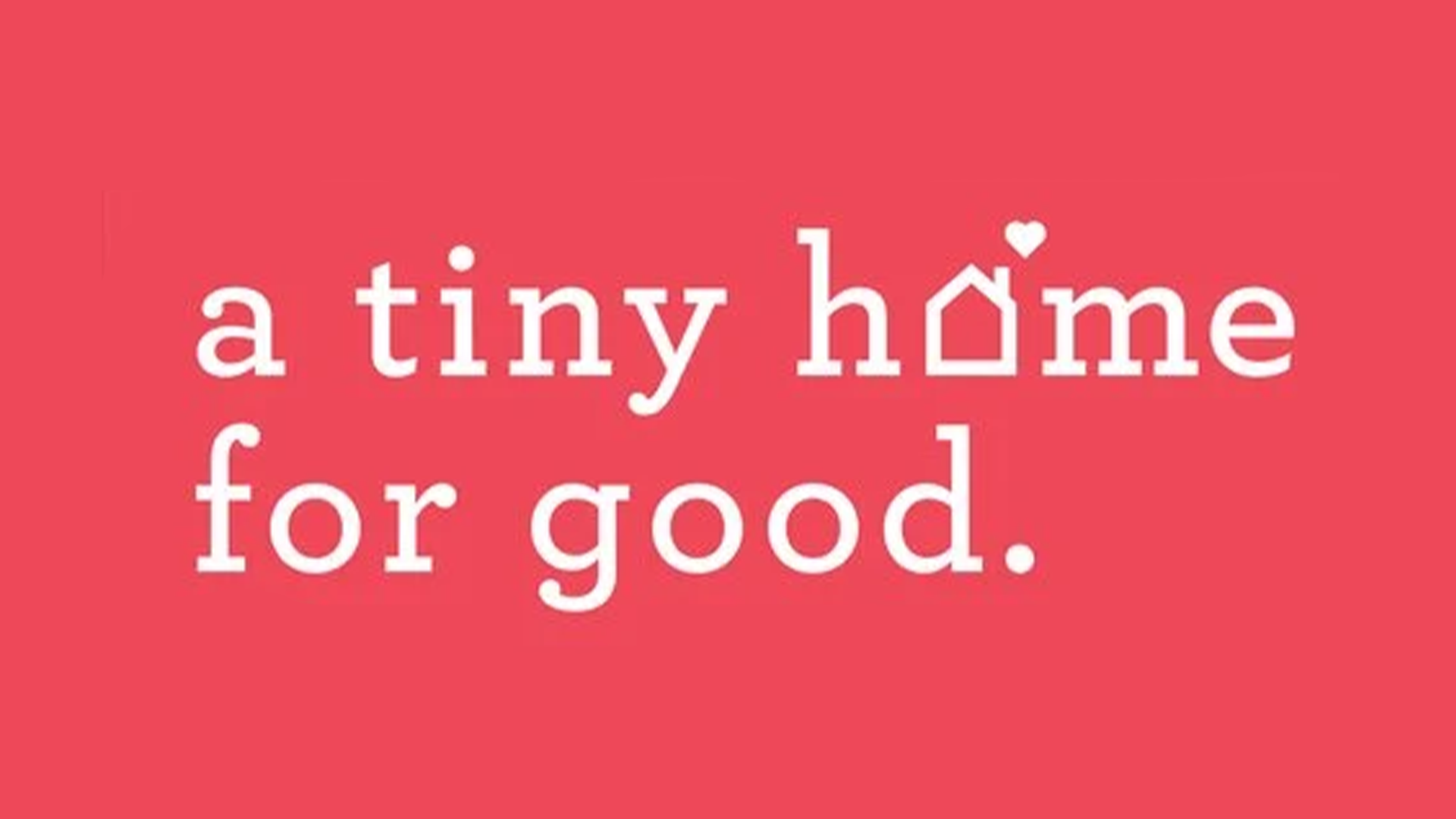 Pink background with white text that says 'a tiny home for good' with a small heart detail above the letter 'm' in 'home'.