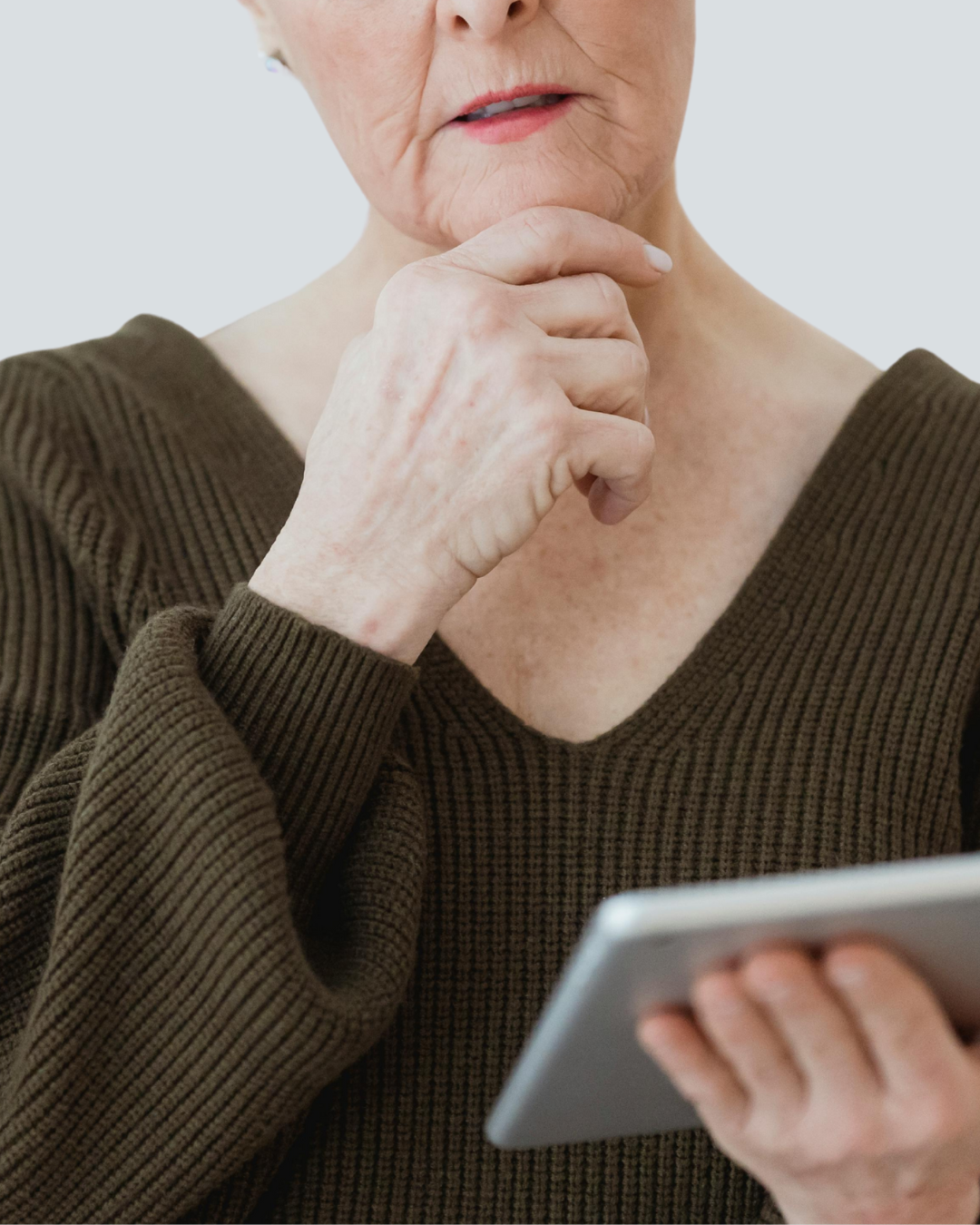 Senior receiving patient smartphone help at home in Naples