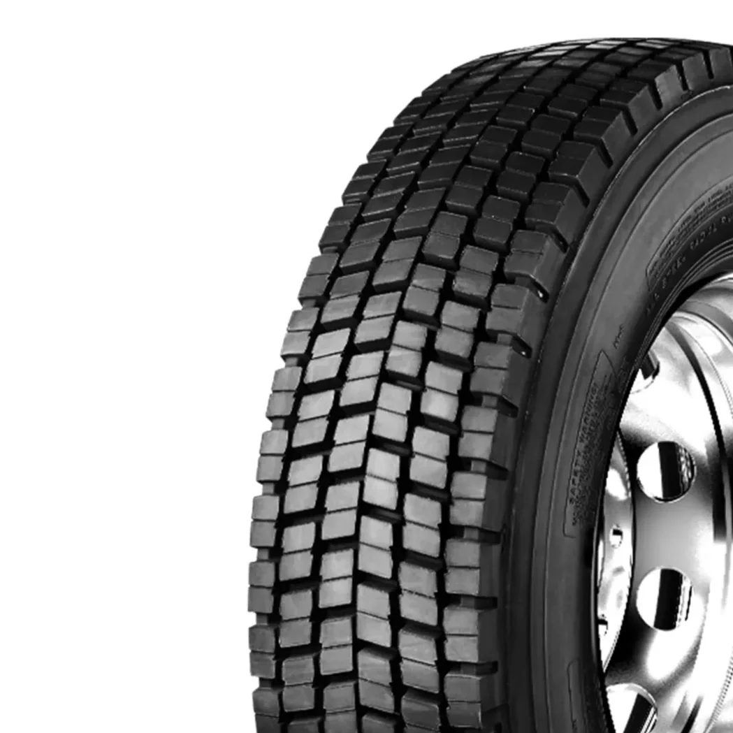 Close-up of a black truck tire with detailed tread pattern.