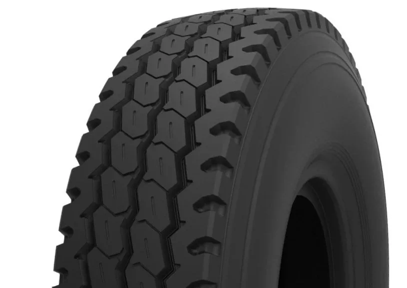 Close-up of a black tire with a detailed tread pattern.