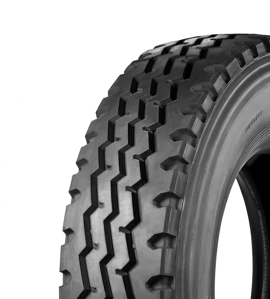 Windpower WGC08. A close-up of a black tire with a rugged tread pattern, mounted on a vehicle. The tire's sidewall has some markings, but they are not fully visible.