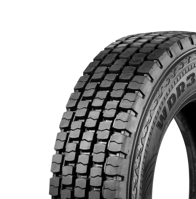 Close-up of a black tire with deep tread pattern, labeled WDR3.