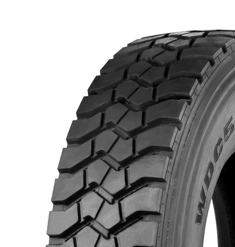 Windpower WDC52 Drive Tyre. Close-up of a black rubber tire with a rugged tread pattern.