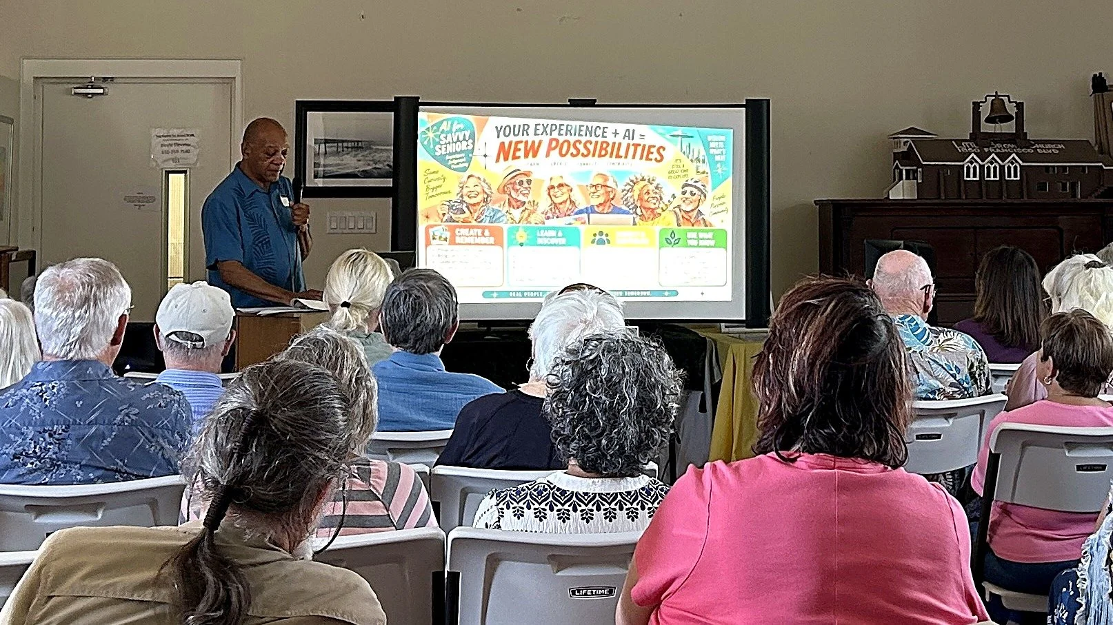 Norm Weekes presenting an AI4 Savvy Seniors workshop to a full room of older adults