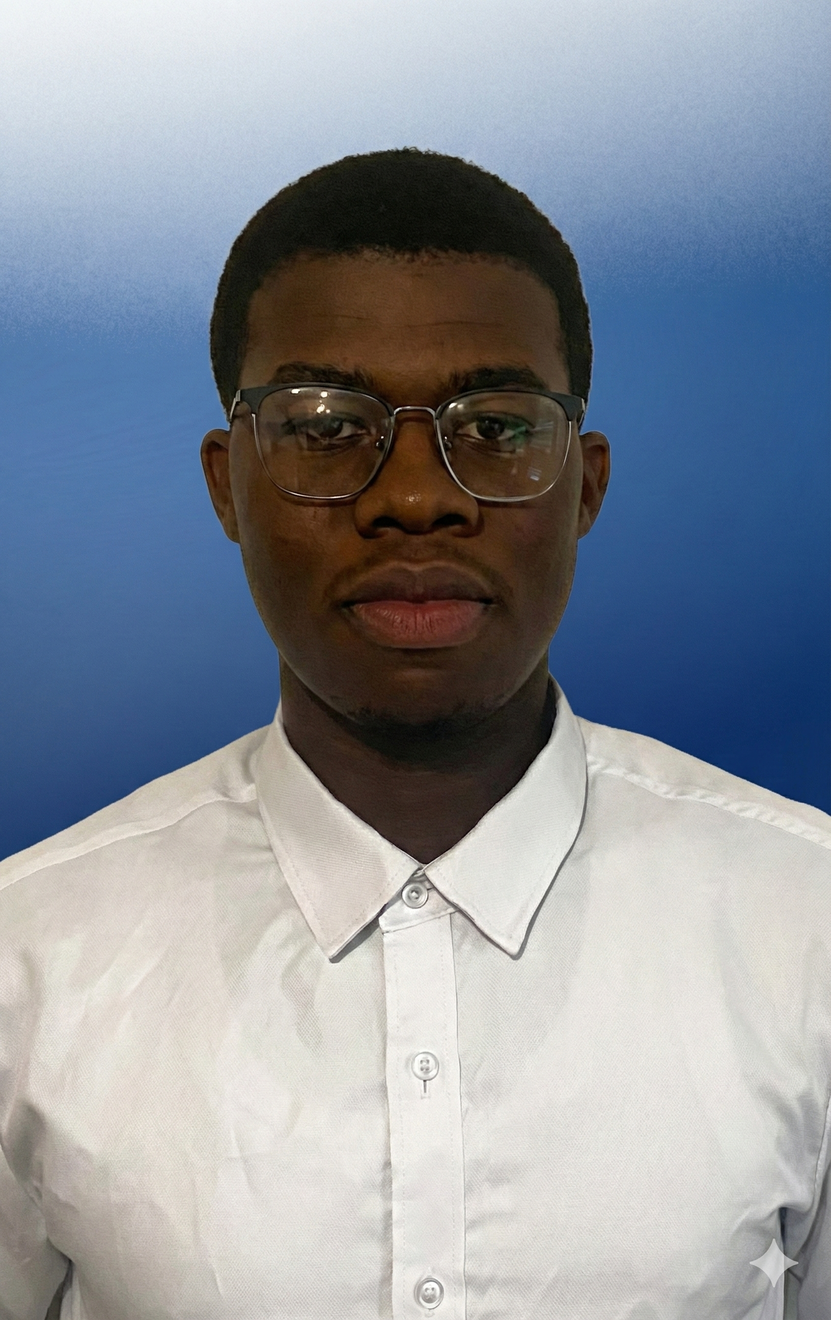 A young man with short hair and glasses wearing a white collared shirt, standing against a blue gradient background.
