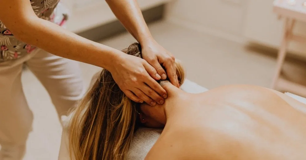 A woman having a massage and finding out the science of myotherapy