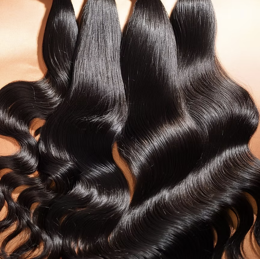 KD Hair Company glossy black body wave hair extensions on neutral background, beauty brand marketing and positioning client.