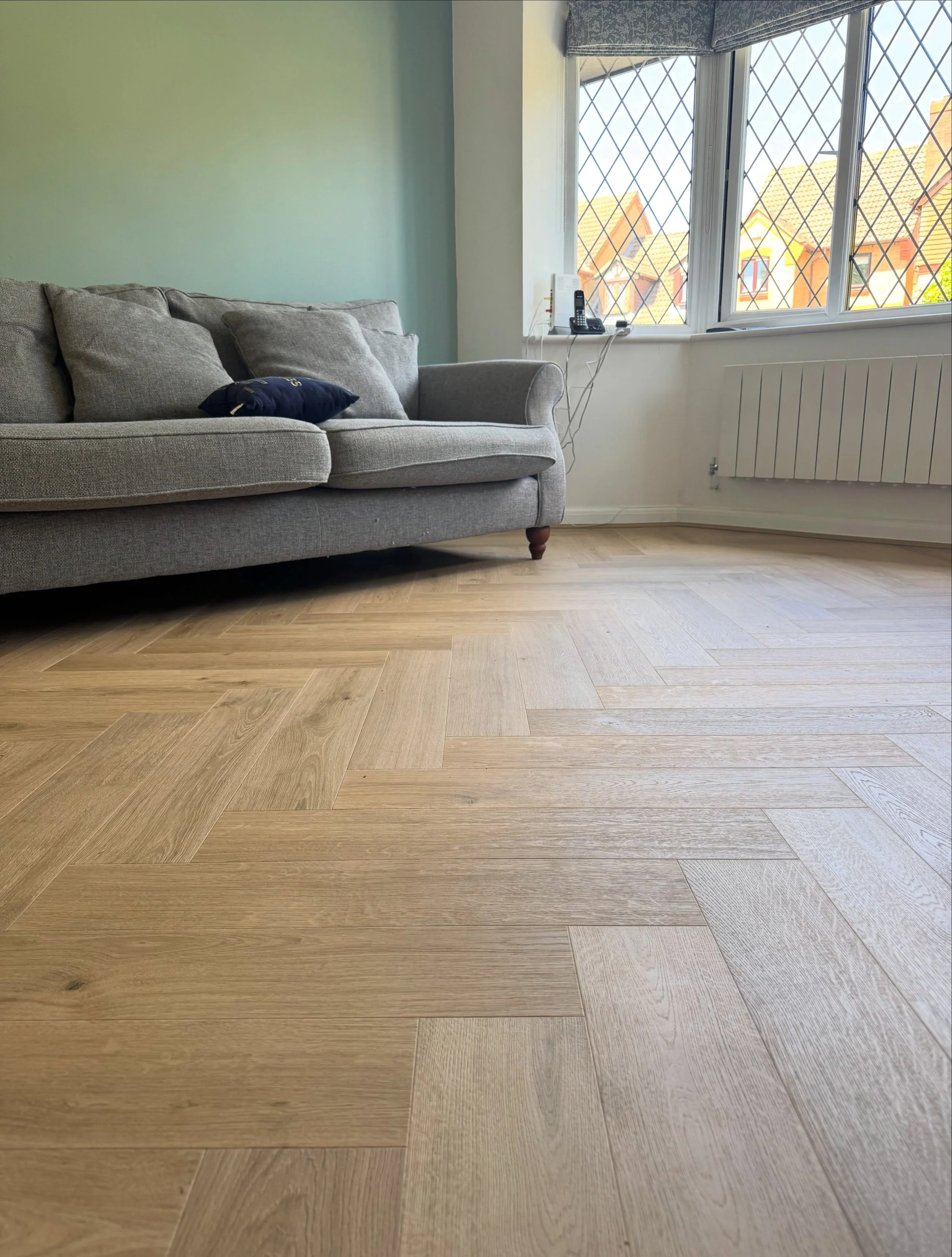 Another week, another herringbone installation! This time we fitted Quick-Step Impressive Design laminate in the stunning Cardamom Oak colour.

Having previously installed the original Impressive Patterns range, our customer came back to us for anoth