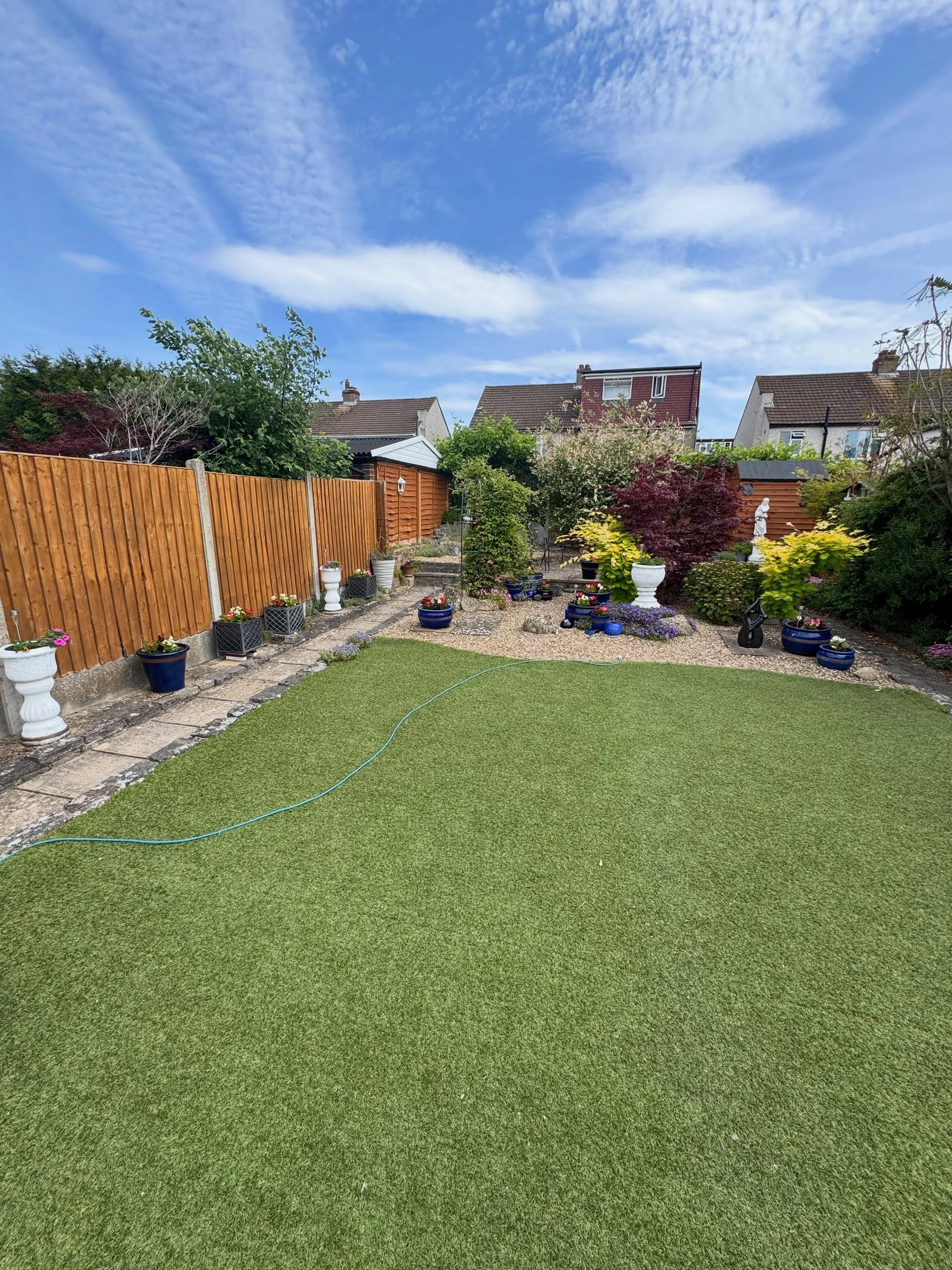 One of our artificial lawns still looking splendid in the sun over 12 years later and now with extra planting space after our customer asked us to pop back and reshape their flower bed 🌷 🌹 ☀️