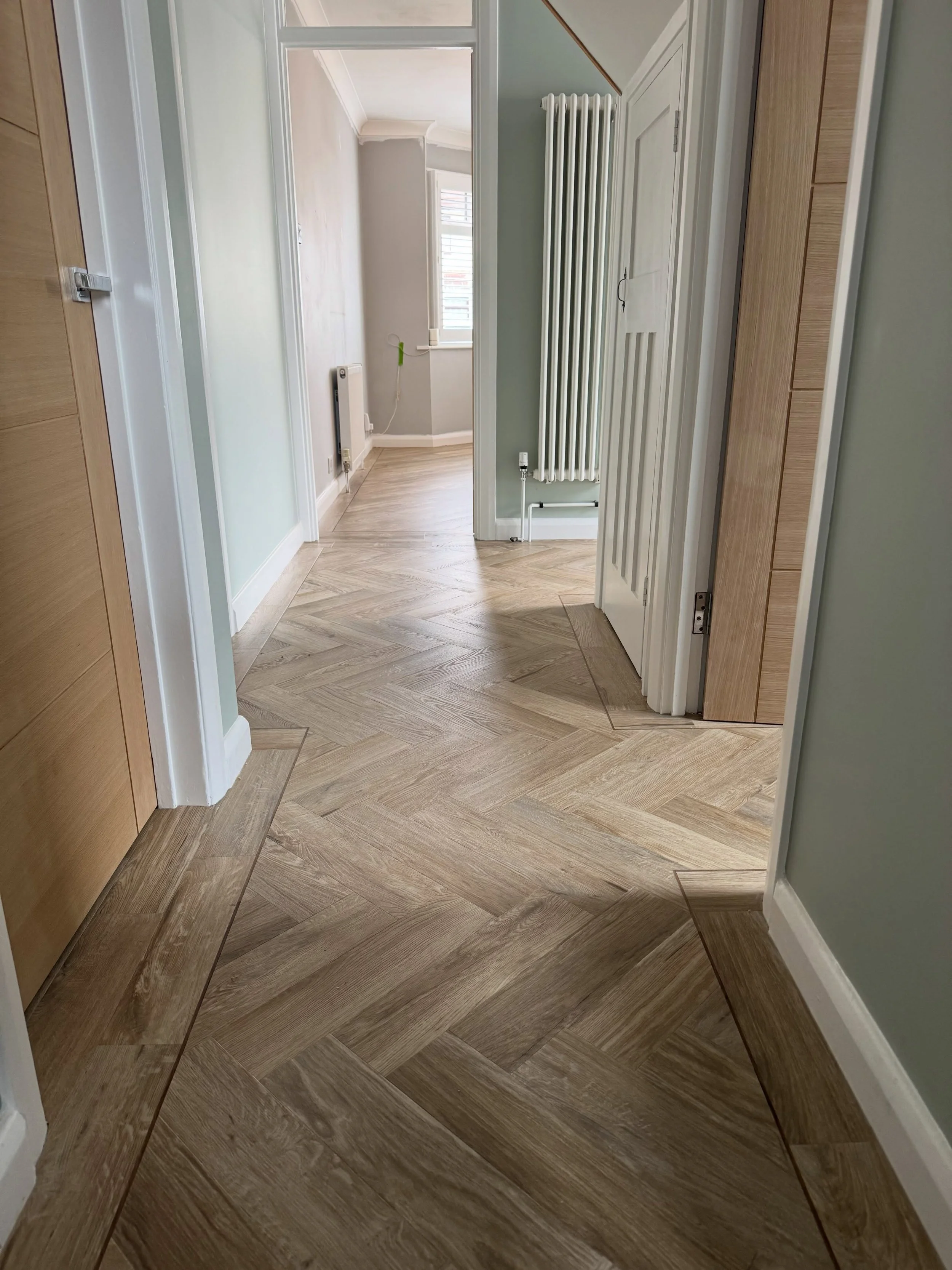 Having fitted the hallway and bathroom earlier this year in Karndean Van Gogh Herringbone colour Hayfield Oak, today we returned to our customer in Bexleyheath to install 56&rdquo; x 9&rdquo; wood plank in the lounge. 

Using the same colour and keep