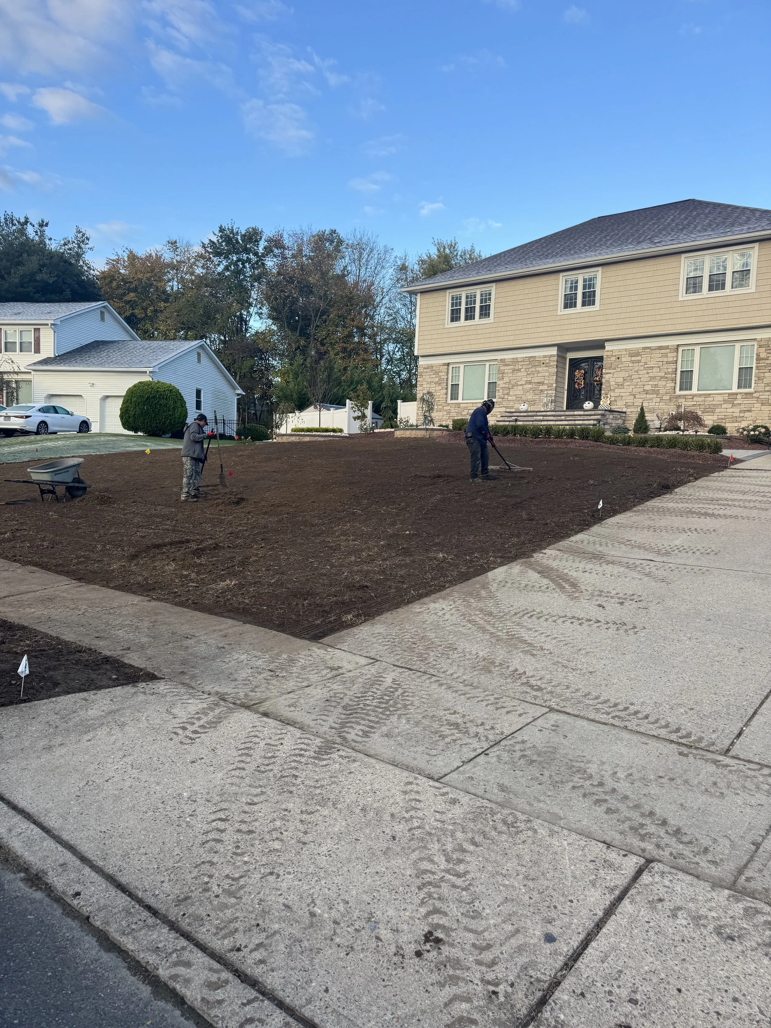 Grading a property level that is being prepped for sod. 