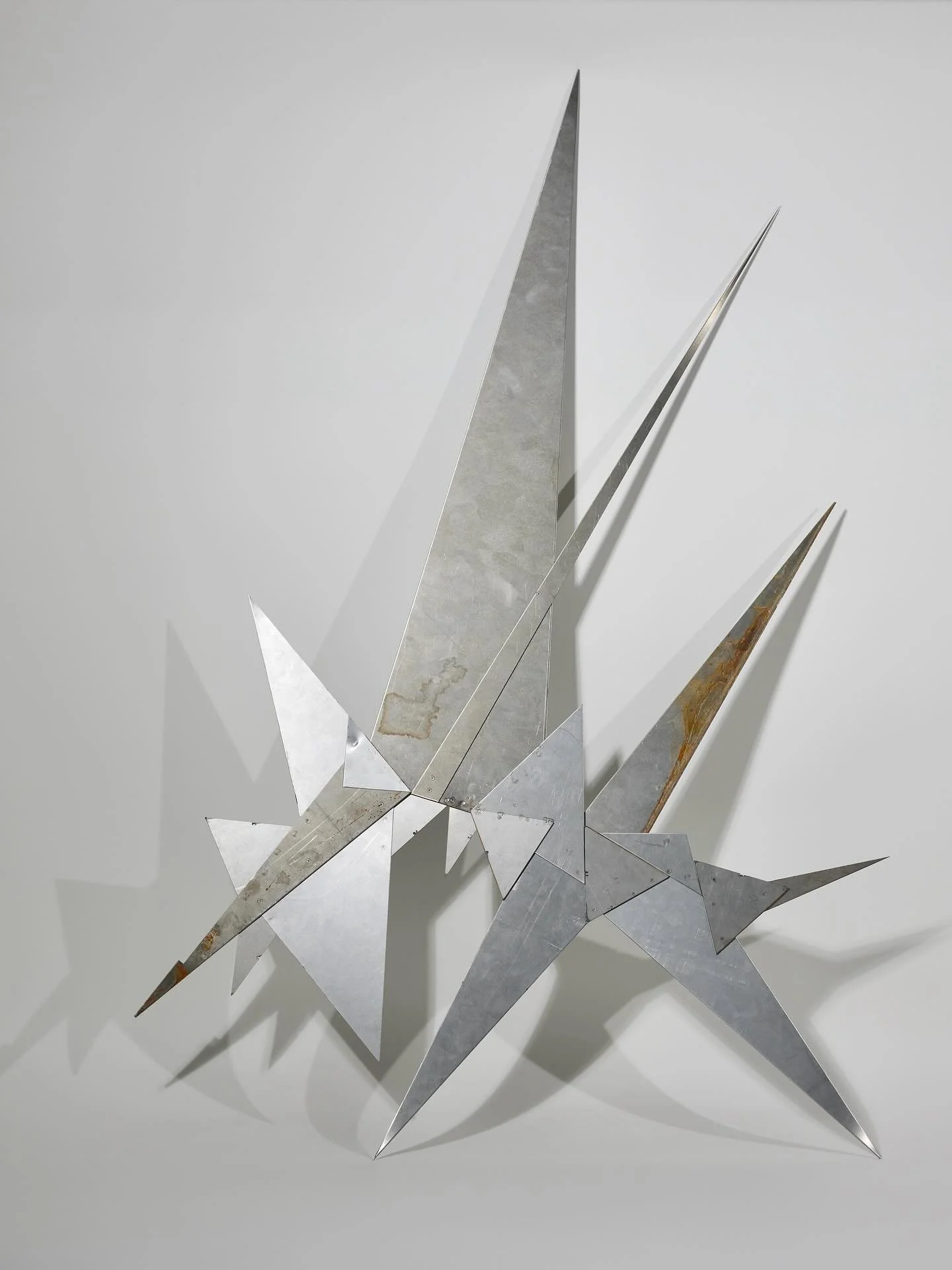 Sterile Star
Mild Steel 
65 x 103cm
2025

Sterile Star reflects on the politics of spatial control, revealing how urban environments often conceal hostility beneath the guise of order and cleanliness. Through its jagged geometry and sharp edges, the 