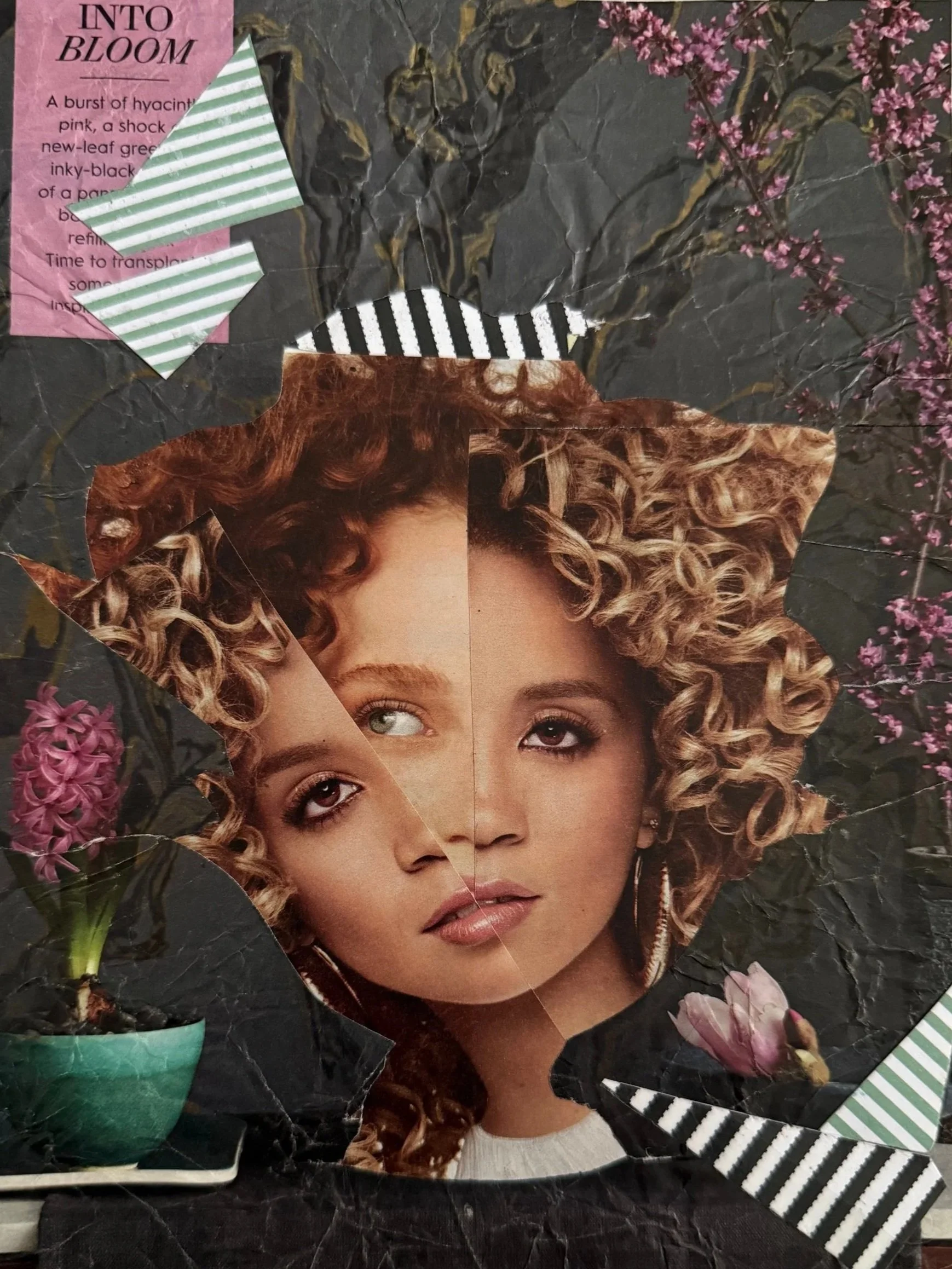 Collage with a central cutout image of three women's faces with curly hair, surrounded by flowers, a black and white striped ribbon, a pink floral bud, and textured black background.