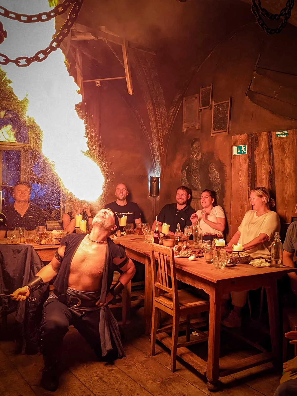 Fire breather in medieval pub in Prague