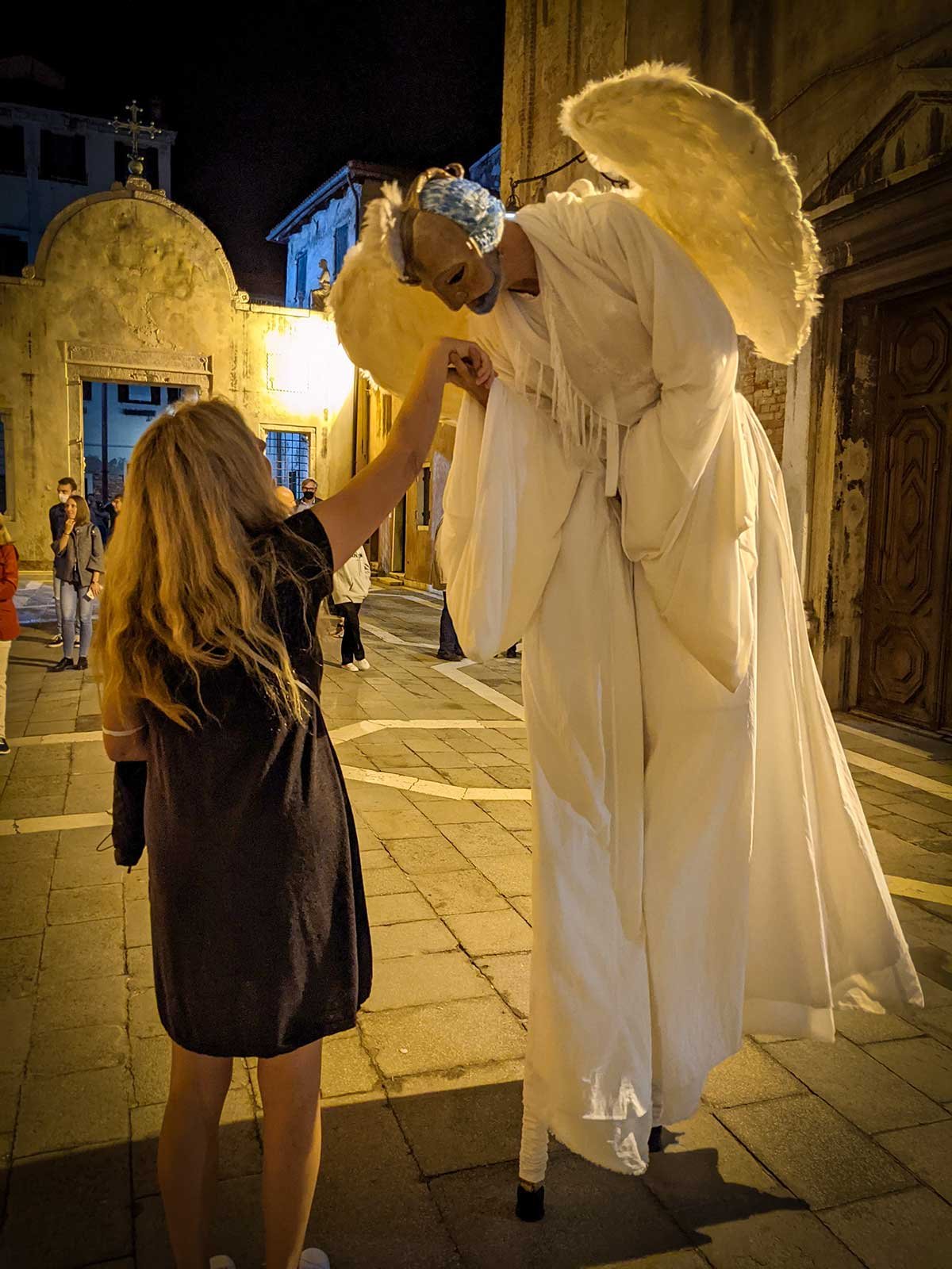 Hand being kissed by an actor as an angel in Venice